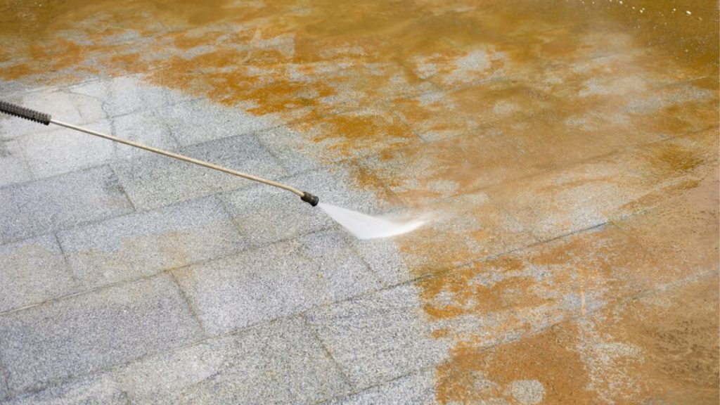 Can Power Washing Remove Rust Stains from Concrete or Metal Surfaces?