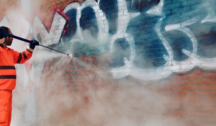 Can Power Washing Remove Oil Stains, Rust, or Graffiti Effectively?