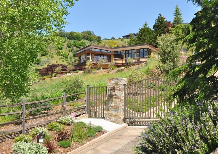 power washing house on a hill