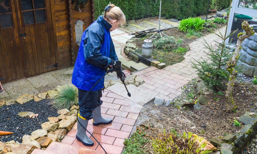 How Does Pressure Washing Affect Landscaping and Garden Beds?